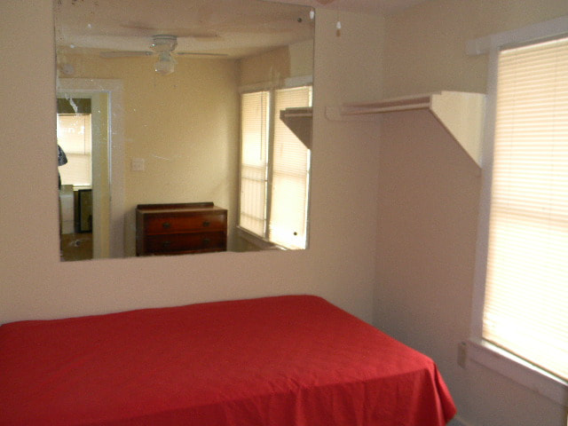 bedroom with window and bed